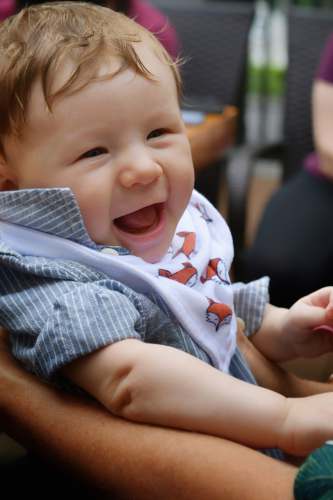 stamford baby in white and red shirt smiling ct