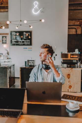 businessman one unknown person holding smartphone wearing blue shirt suit