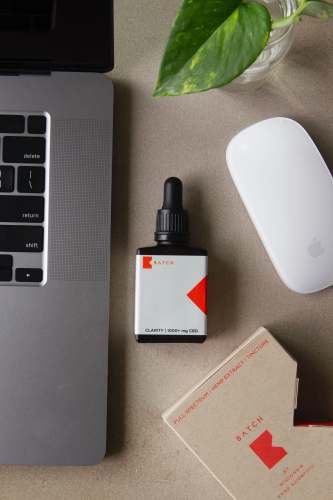 wi white and black plastic bottle beside white apple magic mouse milwaukee