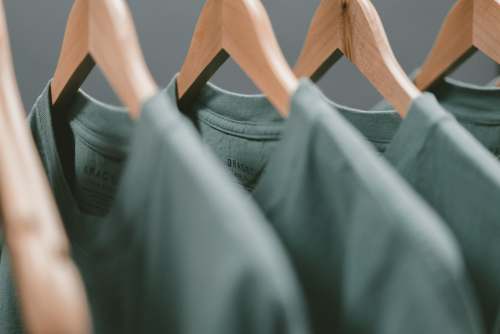 clothing green clothes hanger grey