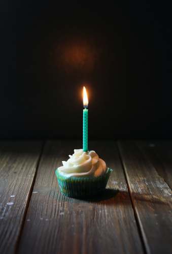 candle taper candle on cupcake 