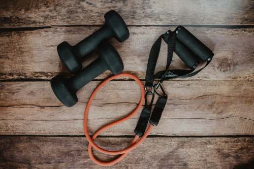  orange and black usb cable on brown wooden surface 