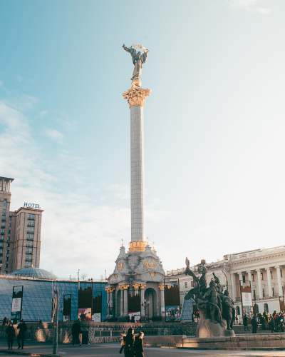  angel statue on pillar during daytime 
